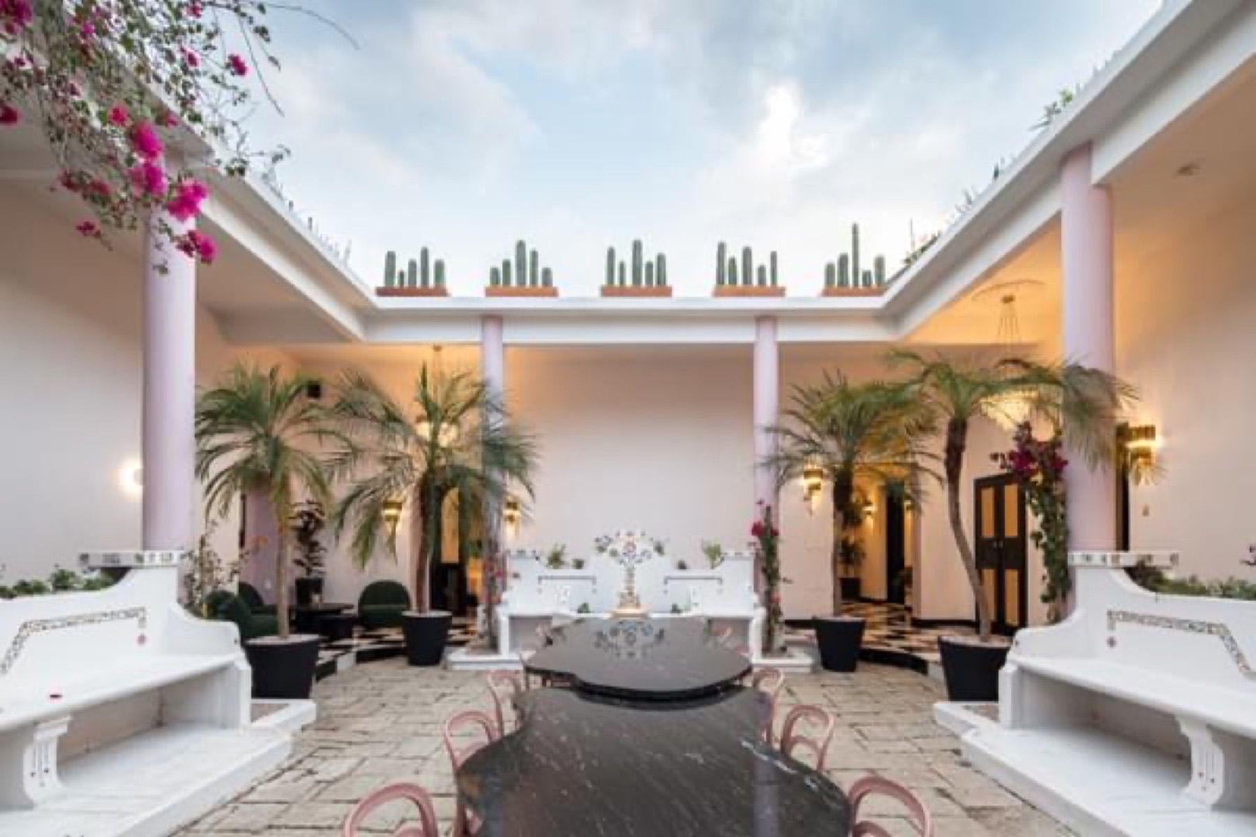 White courtyard with palms in Oaxaca