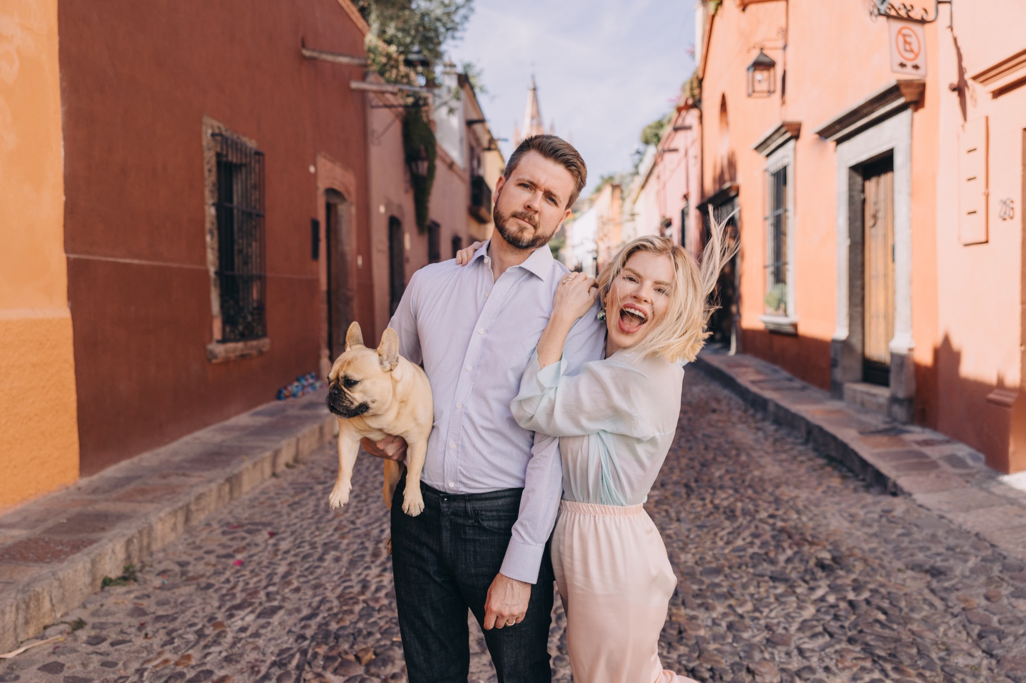 Ben and Ioana laughing on a street in San Miguel de Allende